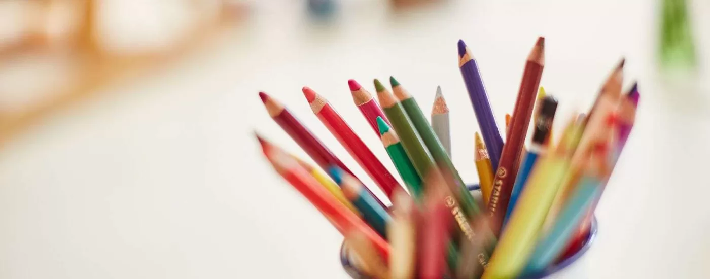 Coloured pencils in a pot